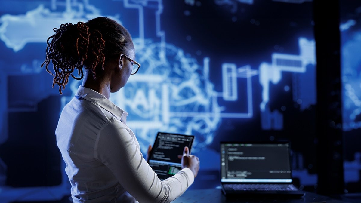 Woman with tablet commanding AI