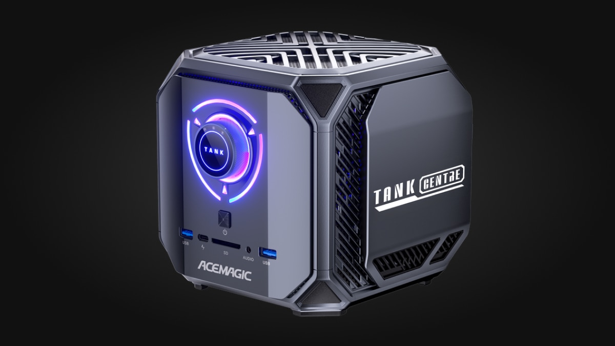 Black ACEMAGIC TANK GEN3 mini PC with purple and blue illuminated front controls and visible ports.