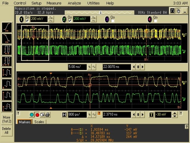 Oscilloscope display with yellow and green traces across two panels showing timing and voltage data.
