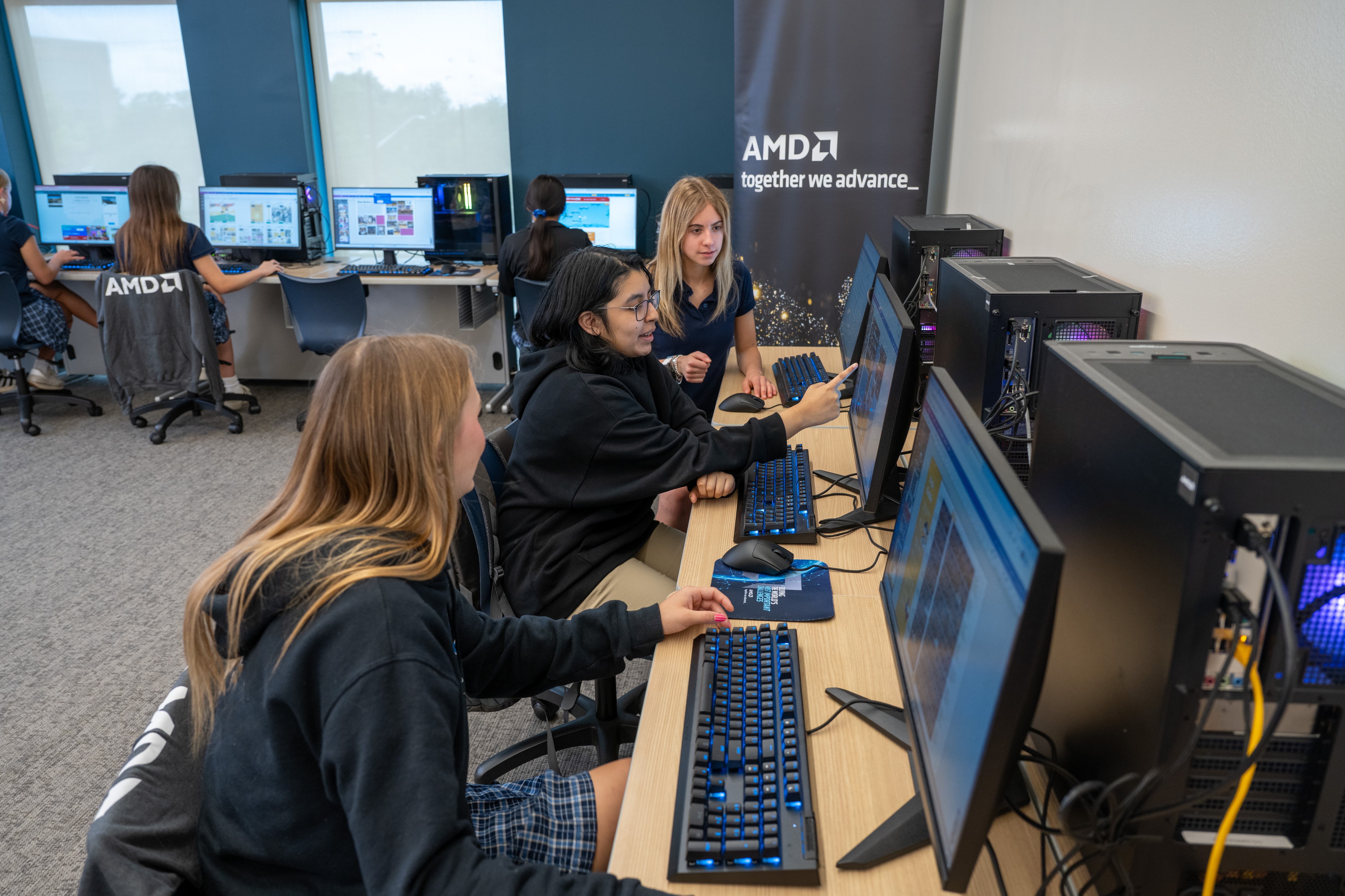 Students at the Ann Richards School for Young Women Leaders in Austin, Texas, collaborate on design and coding projects in the AMD Learning Lab. (Credit: AMD)